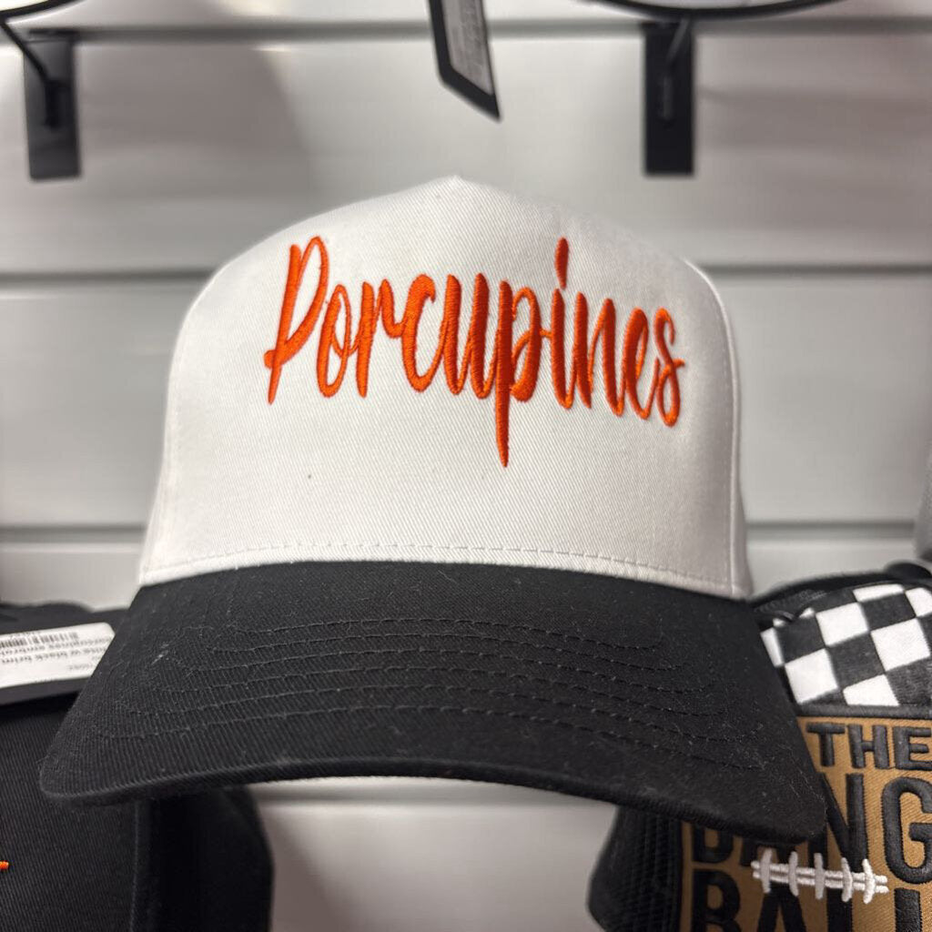White w black brim canvas hat w porcupines embroidered in orange
