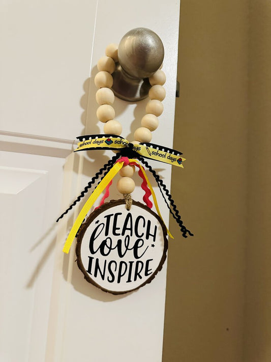 Teach Love Inspire door hanger