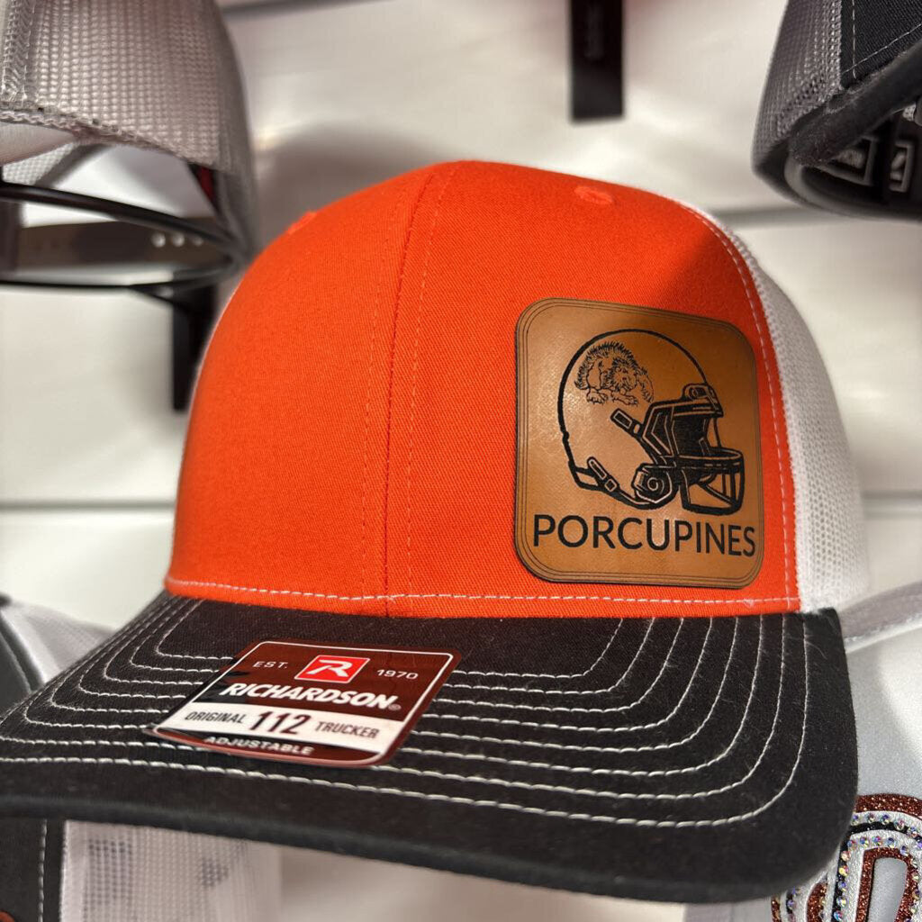 Orange and white with black bill richardson 112 with leather porcupine patch with football Helmet