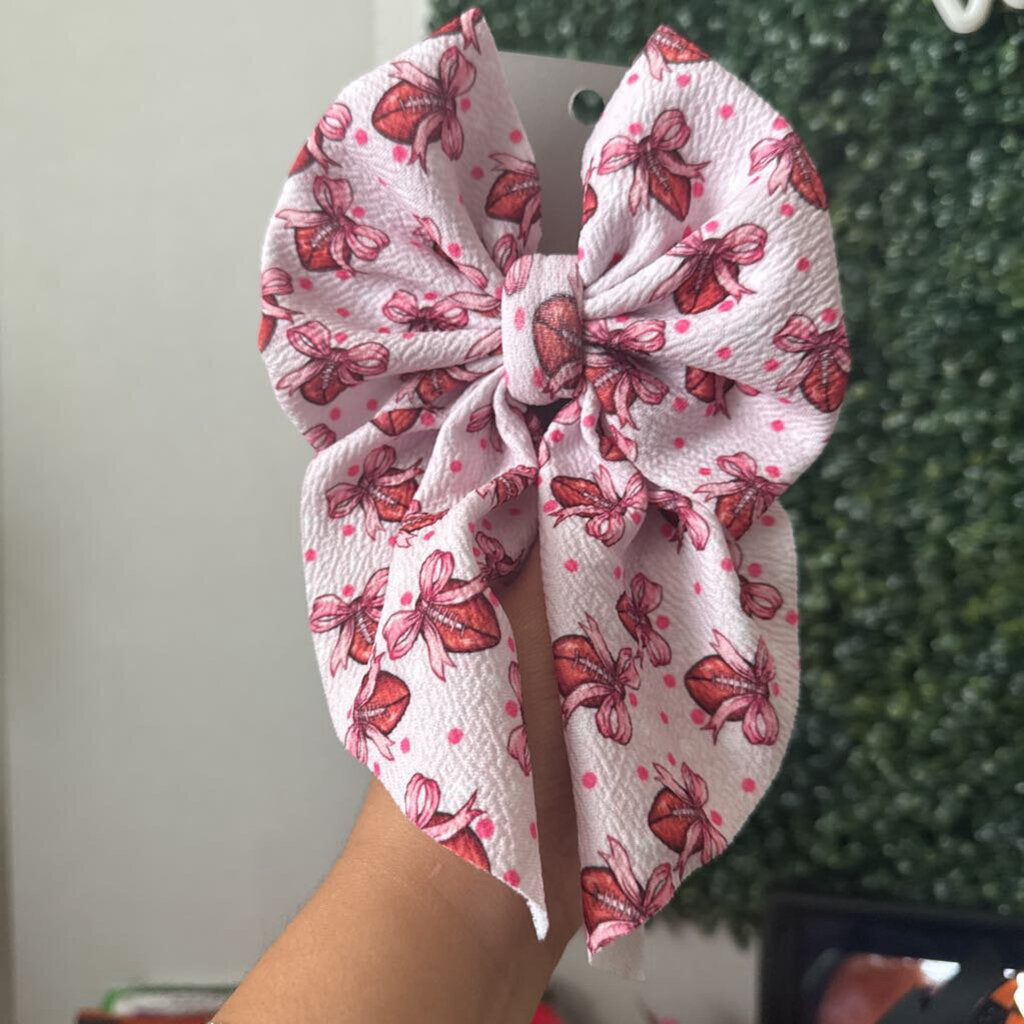 Football with pink bows