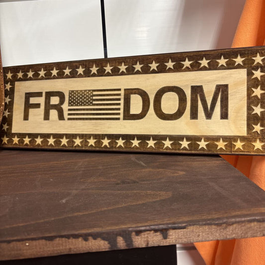 Wood engraved freedom sign